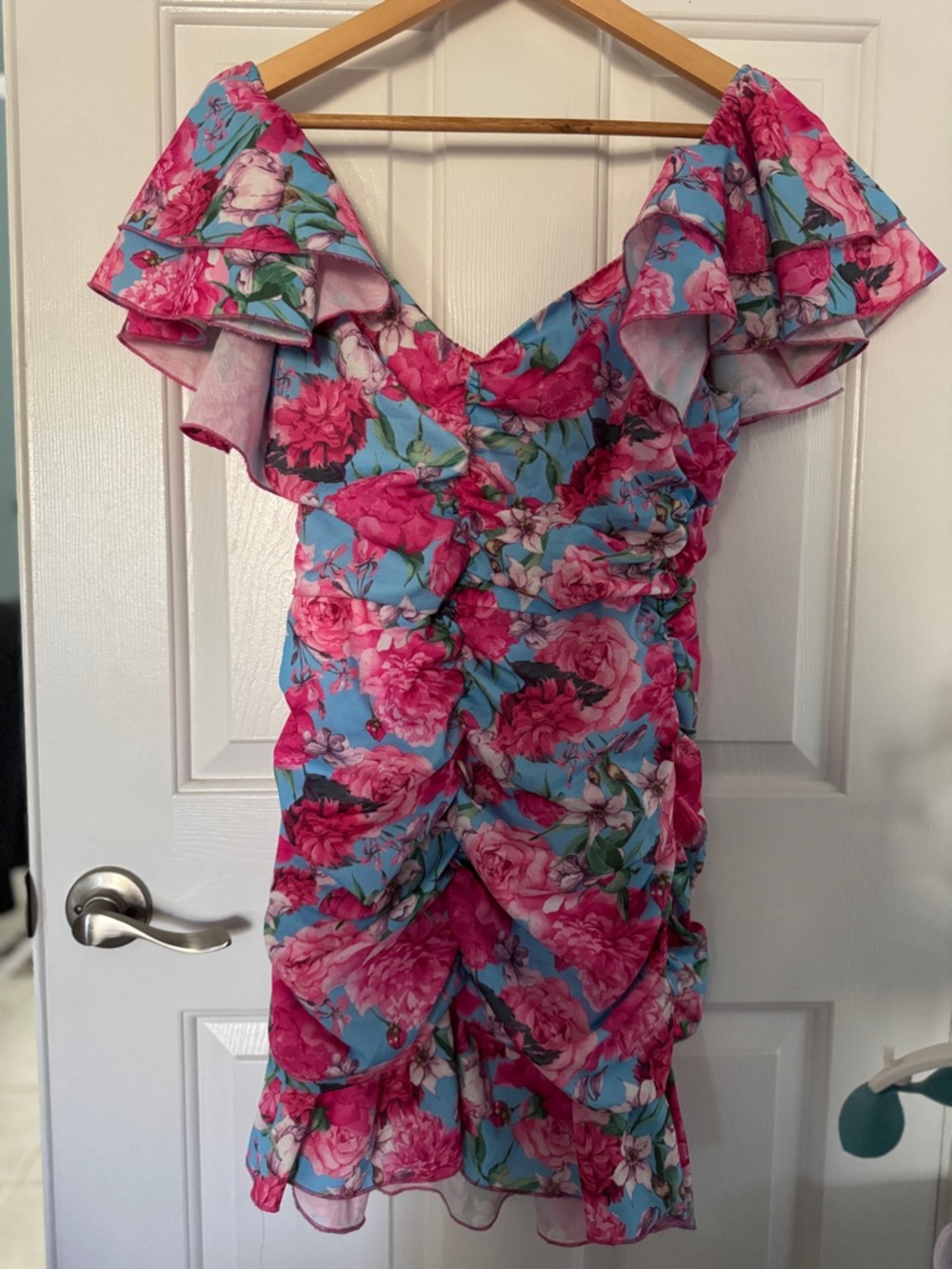 A Peach Floral Ruffle Dress in Blue and Hot Pink